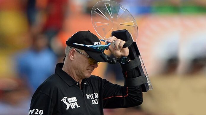 What does an umpire wear on the left hand in the IPL? - Quora