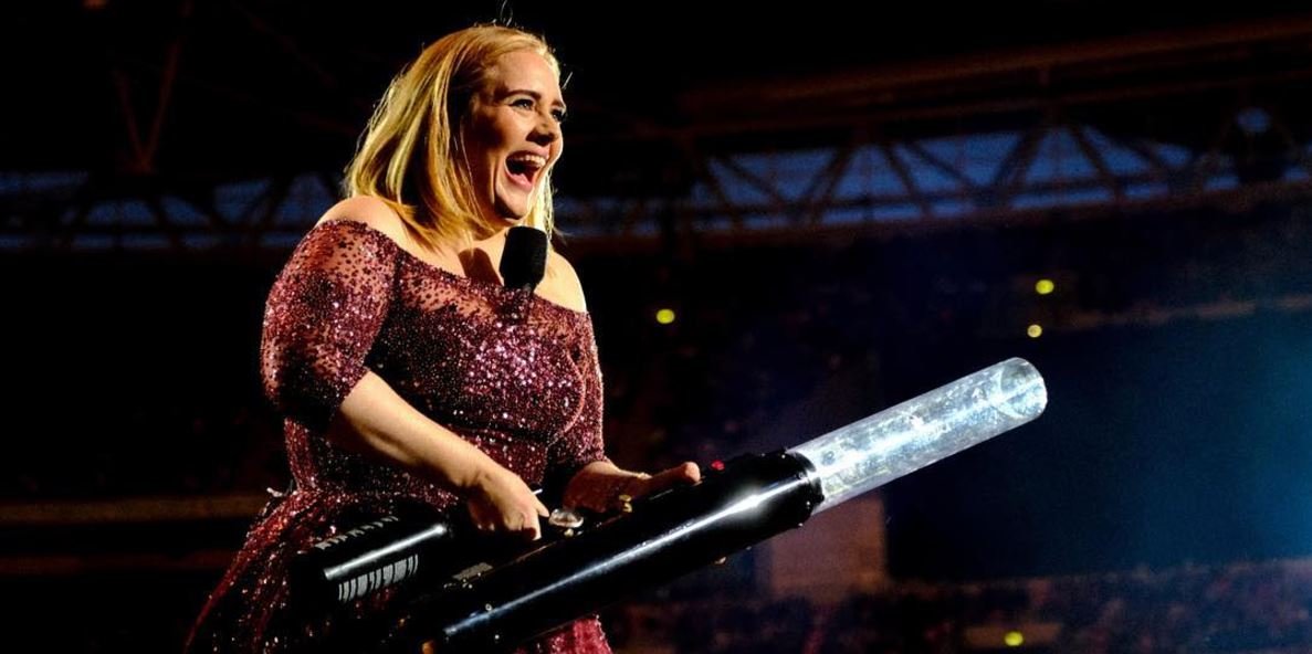 Adele Sparkles in Louis Vuitton & Schiaparelli Gowns at London Concert – WWD