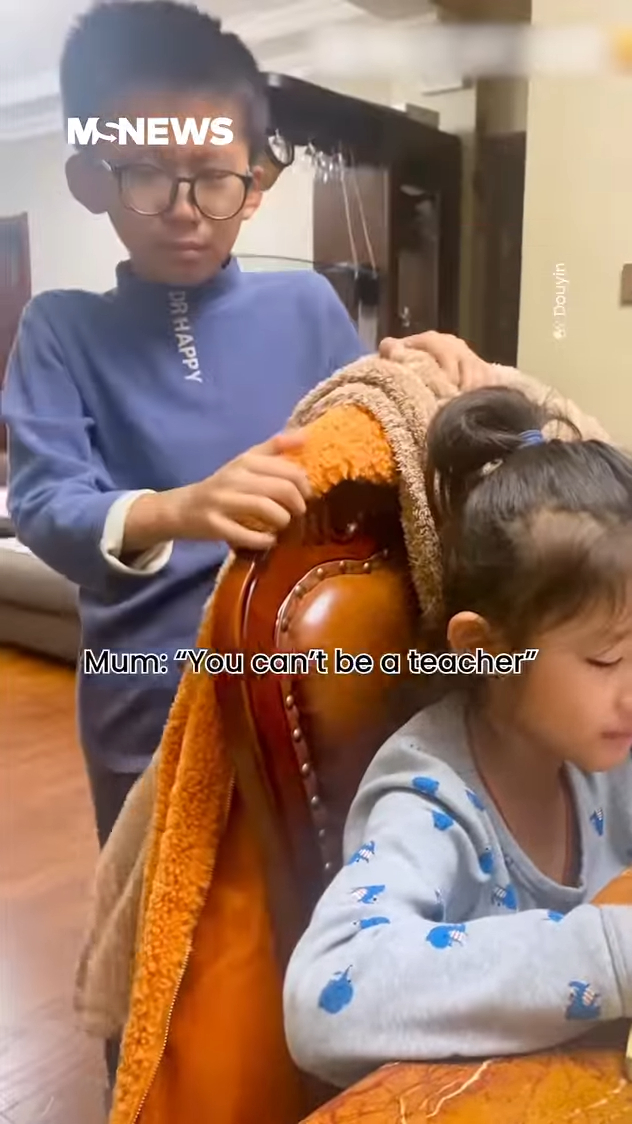 Boy Crying In Frustration As He Teaches Maths To His Sister