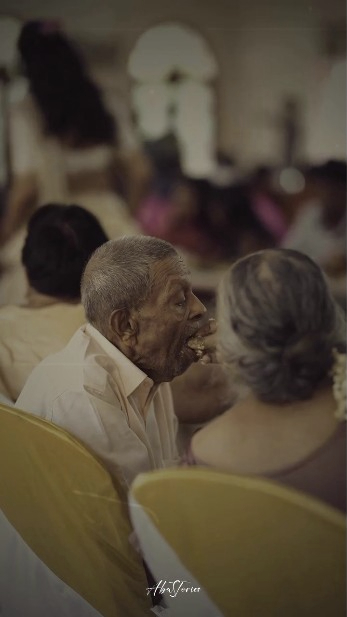 Elderly Woman Feeding Her Husband