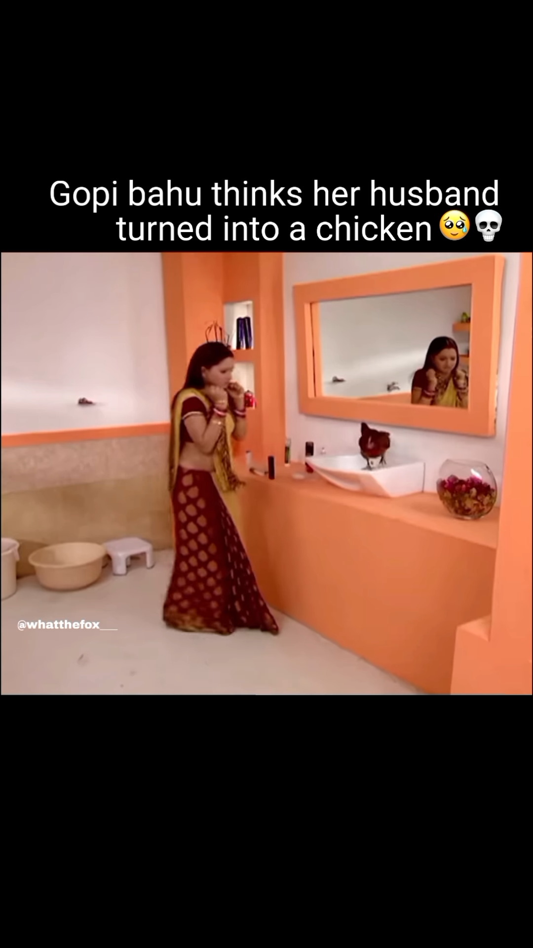 Gopi Bahu talking to a rooster