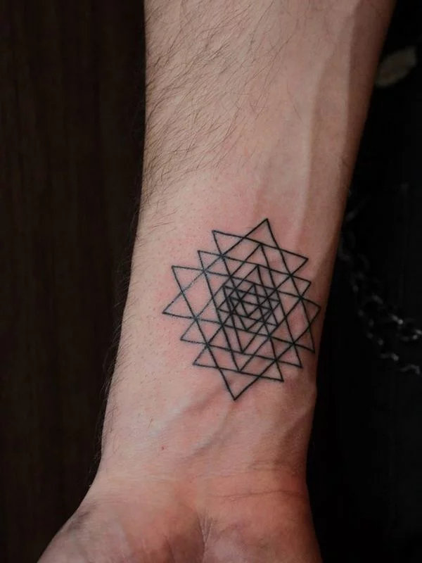 Black Outline Two Triangles Tattoo On Left Wrist