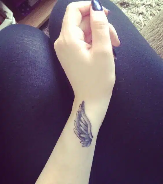 Classy meaningful side wrist tattoos
