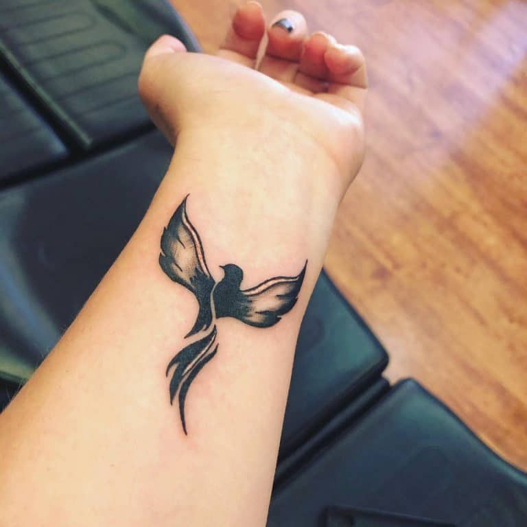 Meaningful wrist cover up tattoos for females