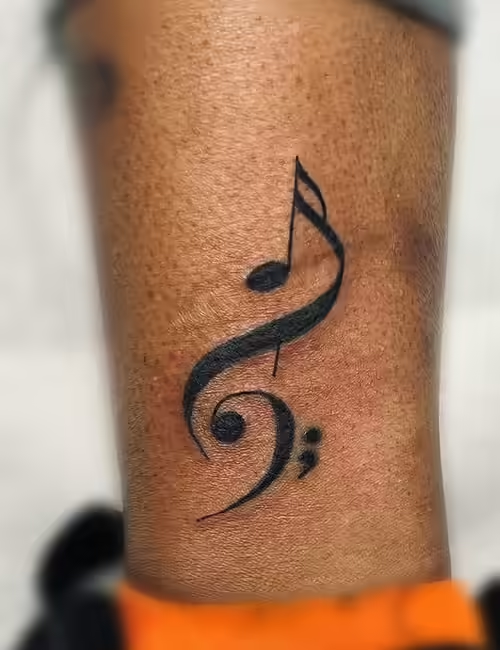 Semicolon tattoo on wrist