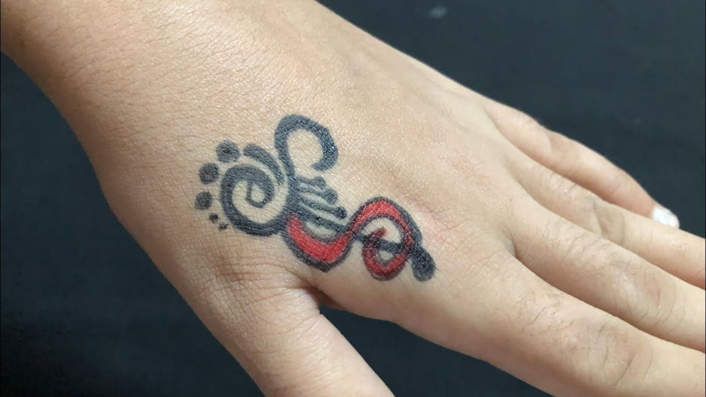 s letter tattoo on wrist