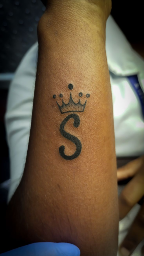 s letter tattoo on wrist