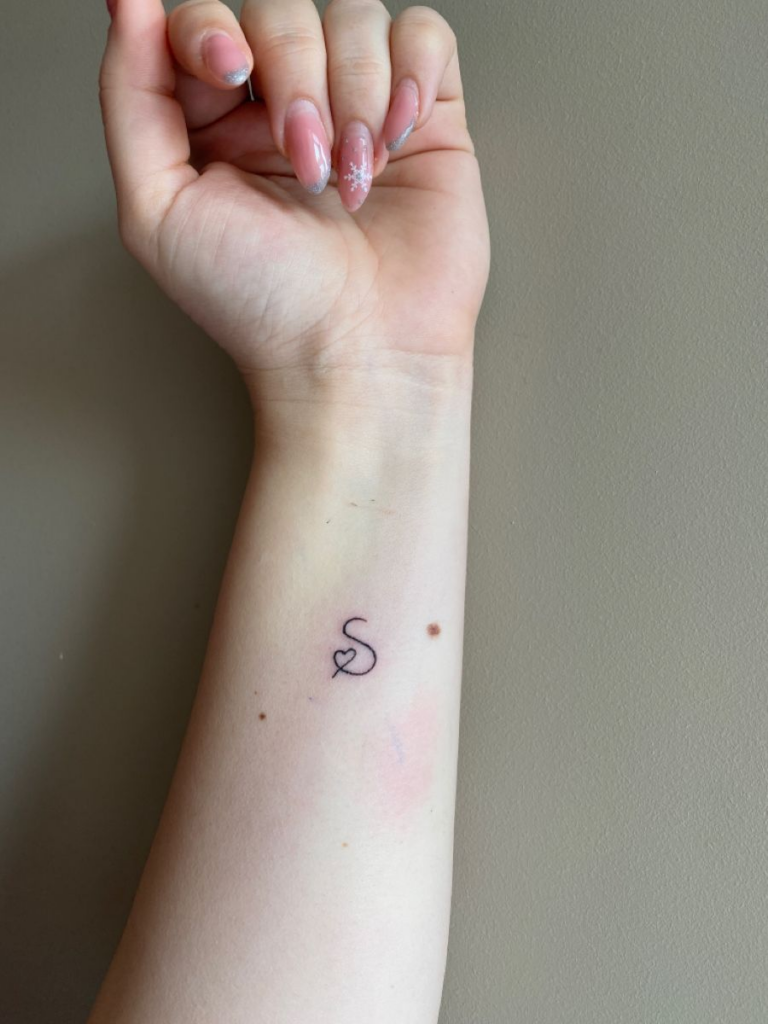 s letter tattoo on wrist