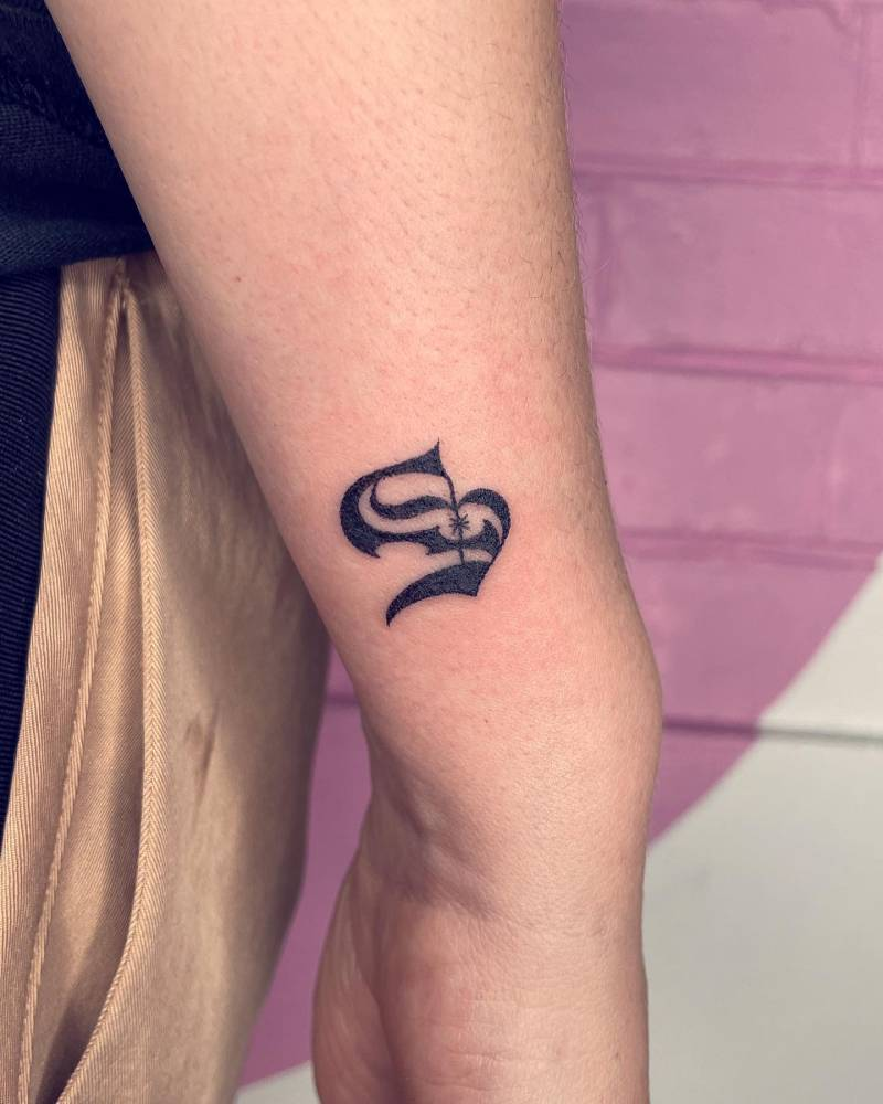 s letter tattoo on wrist