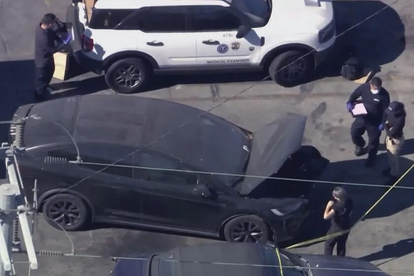 Authorities at Tesla impound scene