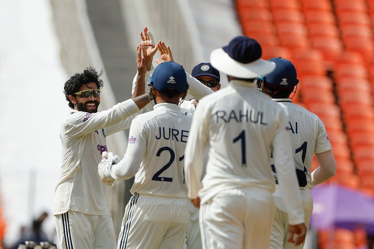 Squad goals unlocked – team India high-fives after a big wicket.