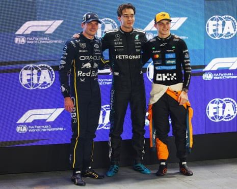 Max, George, and Lando having a whole soap opera on the podium