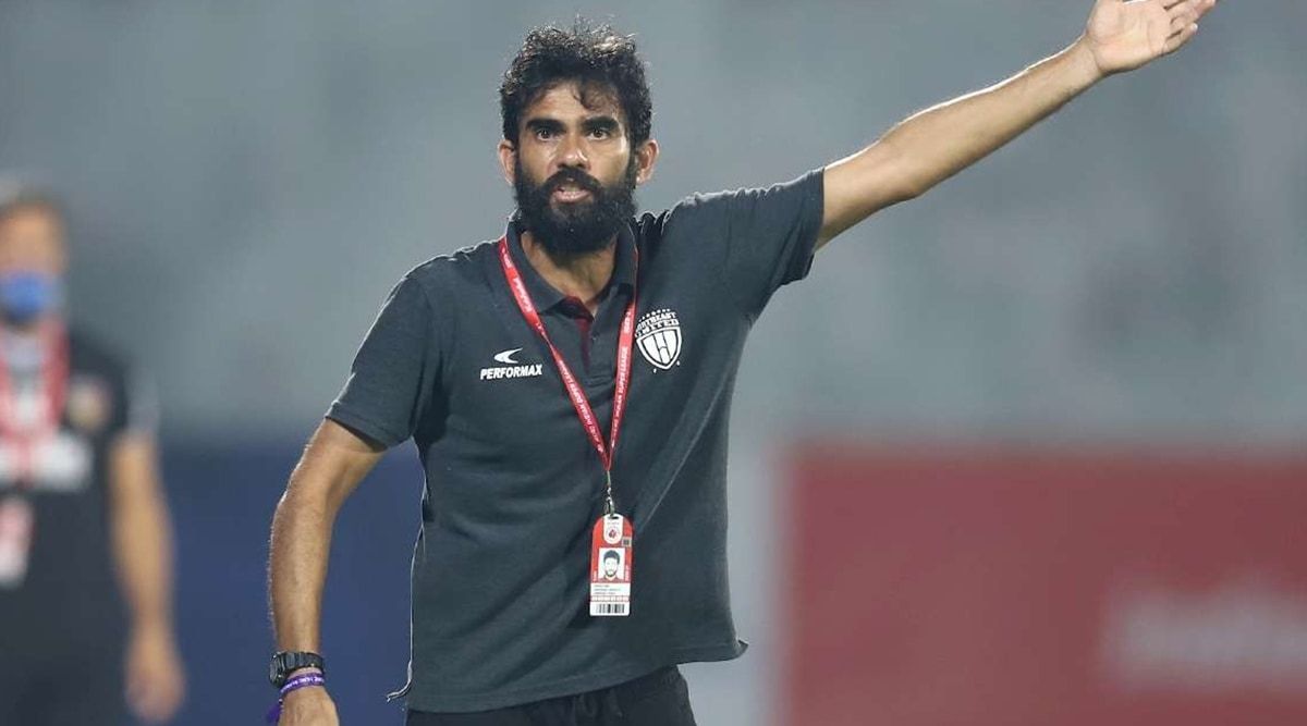 Khalid Jamil animated on the touchline